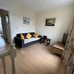 The Snuggly Den Apartment