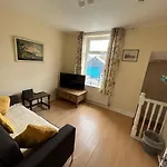 The Snuggly Den Apartment