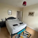 The Snuggly Den Apartment